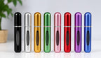 Set de minispray perfumero Fastrok en varios colores metálicos, frascos recargables portátiles para viajes.