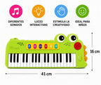 Teclado infantil Fastrok de 37 teclas con diseño de cocodrilo verde, luces LED y funciones musicales interactivas.